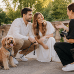 Couple discussing their engagement session with a photographer, with their dog waiting nearby - thelostpie